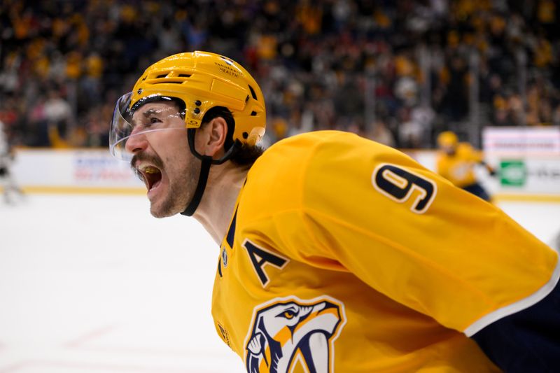 Jan 16, 2025; Nashville, Tennessee, USA;  Nashville Predators left wing Filip Forsberg (9) screams after scoring game tying goal against the Chicago Blackhawks during the third period at Bridgestone Arena. Mandatory Credit: Steve Roberts-Imagn Images