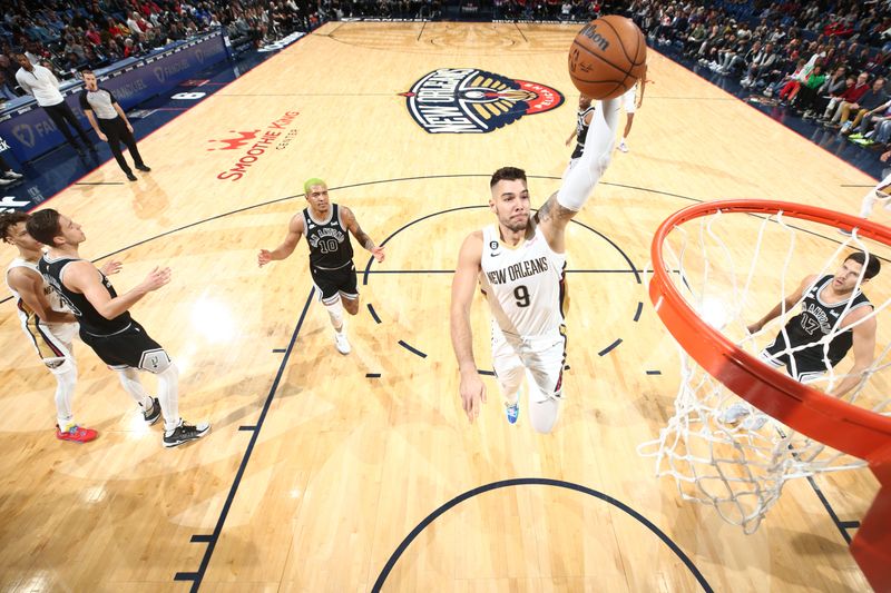 NEW ORLEANS, LA - DECEMBER 22: Willy Hernangomez #9 of the New Orleans Pelicans drives to the basket during the game against the San Antonio Spurs on December 22, 2022 at the Smoothie King Center in New Orleans, Louisiana. NOTE TO USER: User expressly acknowledges and agrees that, by downloading and or using this Photograph, user is consenting to the terms and conditions of the Getty Images License Agreement. Mandatory Copyright Notice: Copyright 2022 NBAE (Photo by Ned Dishman/NBAE via Getty Images)