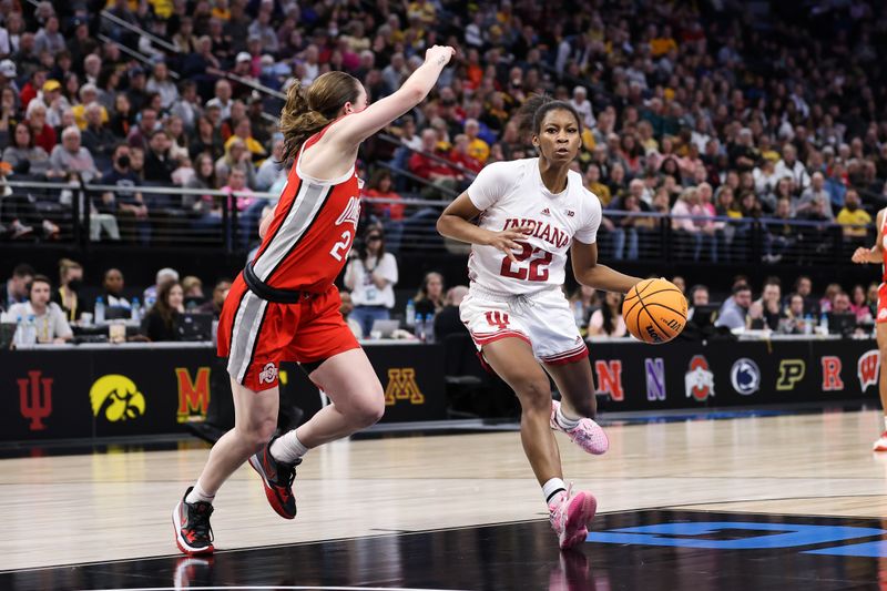 Mar 4, 2023; Minneapolis, MINN, USA; Indiana Hoosiers guard Chloe Moore-McNeil (22) drives to the basket while Ohio State Buckeyes guard Taylor Mikesell (24) defends during the second half at Target Center. Mandatory Credit: Matt Krohn-USA TODAY Sports