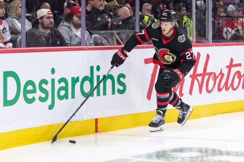 Mar 1, 2024; Ottawa, Ontario, CAN; Ottawa Senators left wing Parker Kelly (27) recovers the puck in the second period against the Arizona Coyotes at the Canadian Tire Centre. Mandatory Credit: Marc DesRosiers-USA TODAY Sports