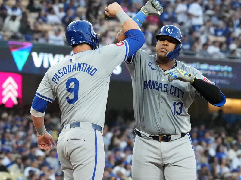 Jun 14, 2024; Los Angeles, California, USA; Kansas City Royals catcher Salvador Perez (13) celebrates with first baseman Vinnie Pasquantino (9) after hitting a three-run home run in the fourth inning against the Los Angeles Dodgers at Dodger Stadium. Mandatory Credit: Kirby Lee-USA TODAY Sports