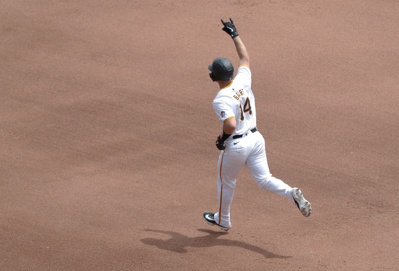 May 23, 2024; Pittsburgh, Pennsylvania, USA; Pittsburgh Pirates catcher Joey Bart (14) gestures as he circles the bases after hitting a grand slam against the San Francisco Giants during the fourth inning at PNC Park. Mandatory Credit: Charles LeClaire-USA TODAY Sports