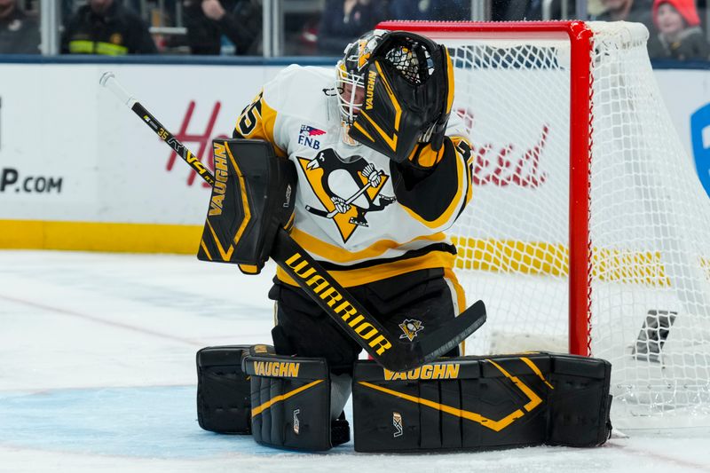 Nov 28, 2025; Columbus, Ohio, USA;  Pittsburgh Penguins goaltender Tristan Jarry (35) makes a glove save in net against the Columbus Blue Jackets in the second period at Nationwide Arena. Mandatory Credit: Aaron Doster-Imagn Images