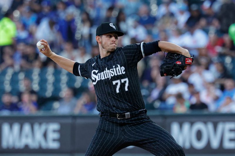 Aug 10, 2024; Chicago, Illinois, USA; Chicago White Sox starting pitcher Chris Flexen (77) delivers a pitch against the Chicago Cubs during the first inning at Guaranteed Rate Field. Mandatory Credit: Kamil Krzaczynski-USA TODAY Sports