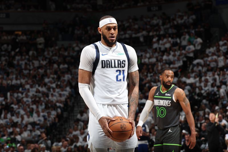 MINNEAPOLIS, MN - MAY 30: Daniel Gafford #21 of the Dallas Mavericks shoots a free throw during the game against the Minnesota Timberwolves during Game 5 of the Western Conference Finals during the 2024 NBA Playoffs on May 30, 2024 at Target Center in Minneapolis, Minnesota. NOTE TO USER: User expressly acknowledges and agrees that, by downloading and or using this Photograph, user is consenting to the terms and conditions of the Getty Images License Agreement. Mandatory Copyright Notice: Copyright 2024 NBAE (Photo by David Sherman/NBAE via Getty Images)