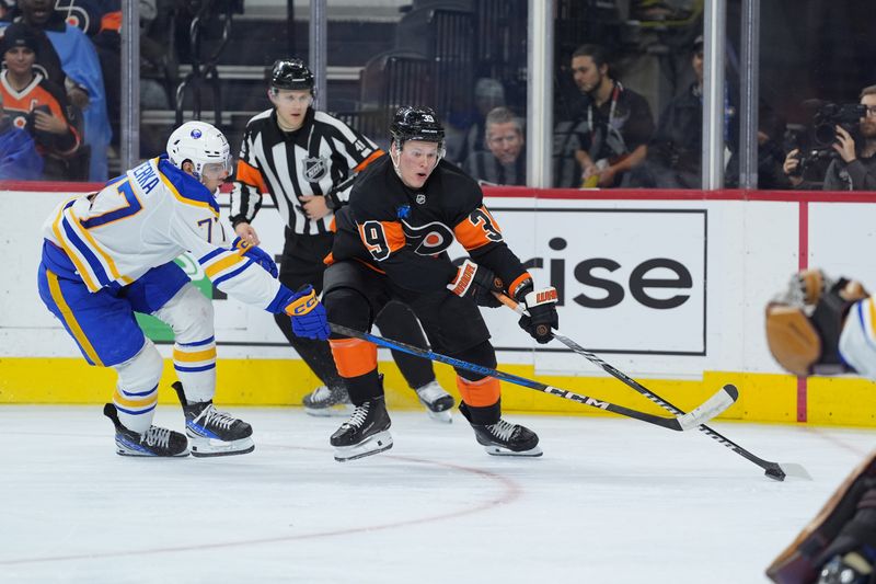 Nov 16, 2024; Philadelphia, Pennsylvania, USA; Philadelphia Flyers right wing Matvei Michkov (39) pushes the puck past Buffalo Sabres right wing JJ Peterka (77) in the third period at Wells Fargo Center. Mandatory Credit: Kyle Ross-Imagn Images