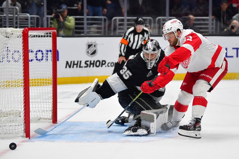 Oct 30, 2025; Los Angeles, California, USA; Los Angeles Kings goaltender Darcy Kuemper (35) blocks the shot of Detroit Red Wings right wing Alex Debrincat (93) during the shootout at Crypto.com Arena. Mandatory Credit: Gary A. Vasquez-Imagn Images