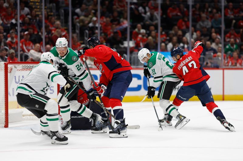 Oct 17, 2024; Washington, District of Columbia, USA; Dallas Stars left wing Jason Robertson (21) scores a goal on Washington Capitals goaltender Charlie Lindgren (79) in the second period at Capital One Arena. Mandatory Credit: Geoff Burke-Imagn Images