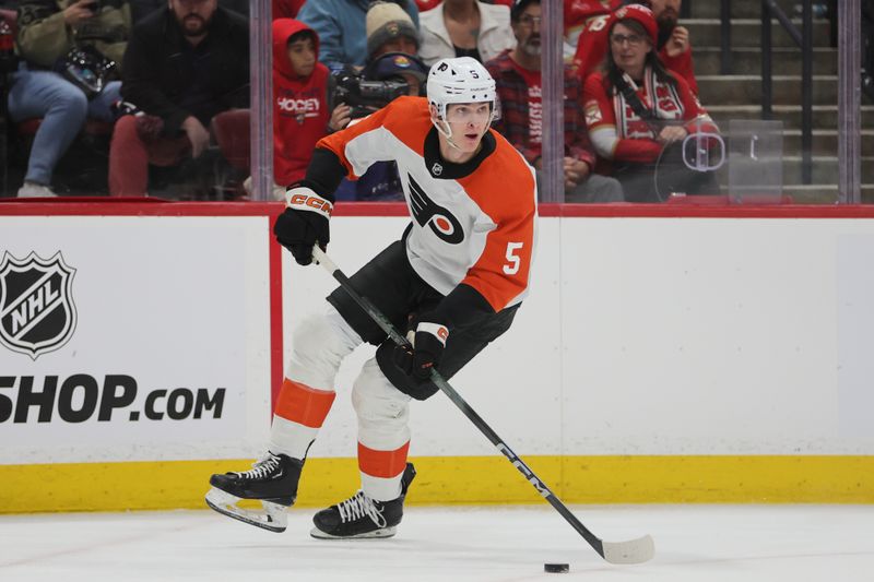 Feb 6, 2024; Sunrise, Florida, USA; Philadelphia Flyers defenseman Egor Zamula (5) moves the puck against the Florida Panthers during the second period at Amerant Bank Arena. Mandatory Credit: Sam Navarro-USA TODAY Sports