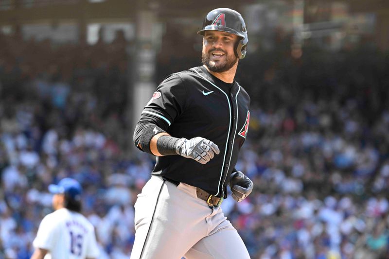 Jul 21, 2024; Chicago, Illinois, USA;  Arizona Diamondbacks third baseman Eugenio Suárez runs the bases after hitting a home run against the Chicago Cubs during the seventh inning at Wrigley Field. Mandatory Credit: Matt Marton-USA TODAY Sports