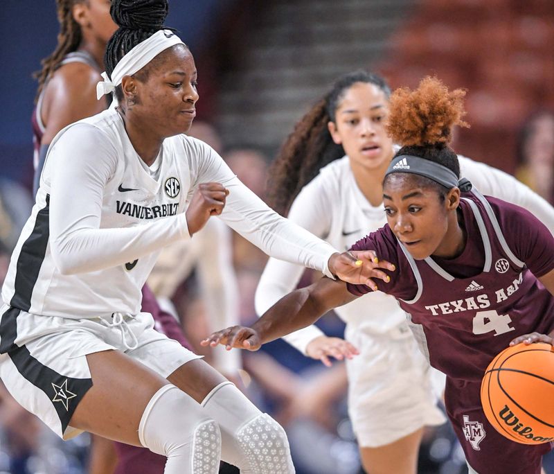 Mar 1, 2023; Greenville, SC, USA; Vanderbilt forward Yaubryon Chambers (5) guards Texas A&M guard Kay Kay Green (4) during the third quarter of the SEC Women's Basketball Tournament at Bon Secours Wellness Arena. Mandatory Credit: Ken Ruinard-USA TODAY Sports