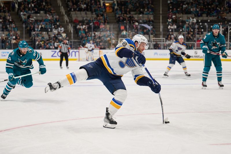 Apr 6, 2024; San Jose, California, USA; St. Louis Blues left wing Nathan Walker (26) shoots the puck against the San Jose Sharks during the third period at SAP Center at San Jose. Mandatory Credit: Robert Edwards-USA TODAY Sports