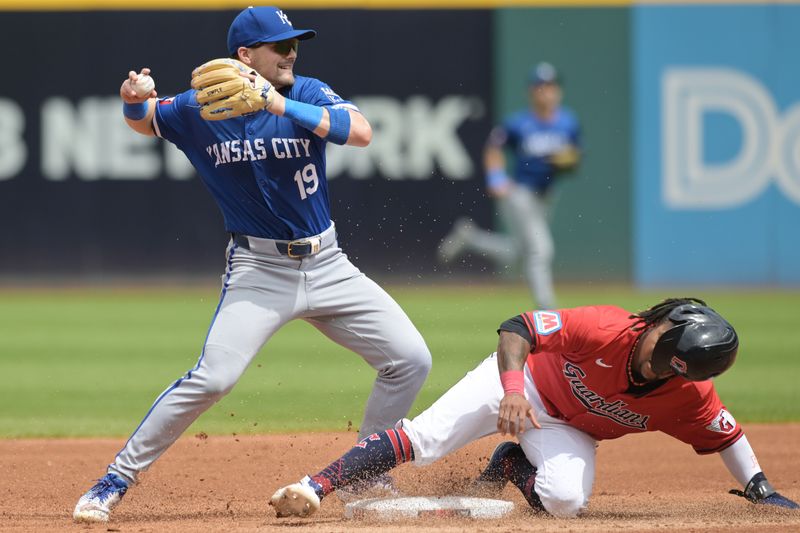 Aug 28, 2024; Cleveland, Ohio, USA; Kansas City Royals second baseman Michael Massey (19) forces out Cleveland Guardians third baseman Jose Ramirez (11) during the first inning at Progressive Field. Mandatory Credit: Ken Blaze-USA TODAY Sports