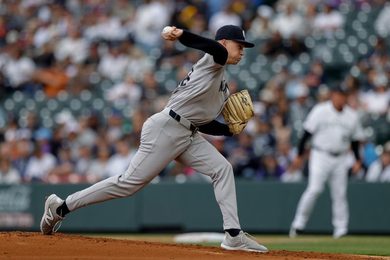May 25, 2025; Denver, Colorado, USA; New York Yankees starting pitcher Will Warren (98) pitches in the first inning against the Colorado Rockies at Coors Field. Mandatory Credit: Isaiah J. Downing-Imagn Images