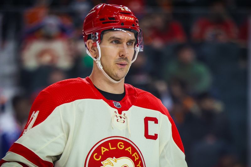 Jan 20, 2024; Calgary, Alberta, CAN; Calgary Flames center Mikael Backlund (11) during the third period against the Edmonton Oilers at Scotiabank Saddledome. Mandatory Credit: Sergei Belski-USA TODAY Sports