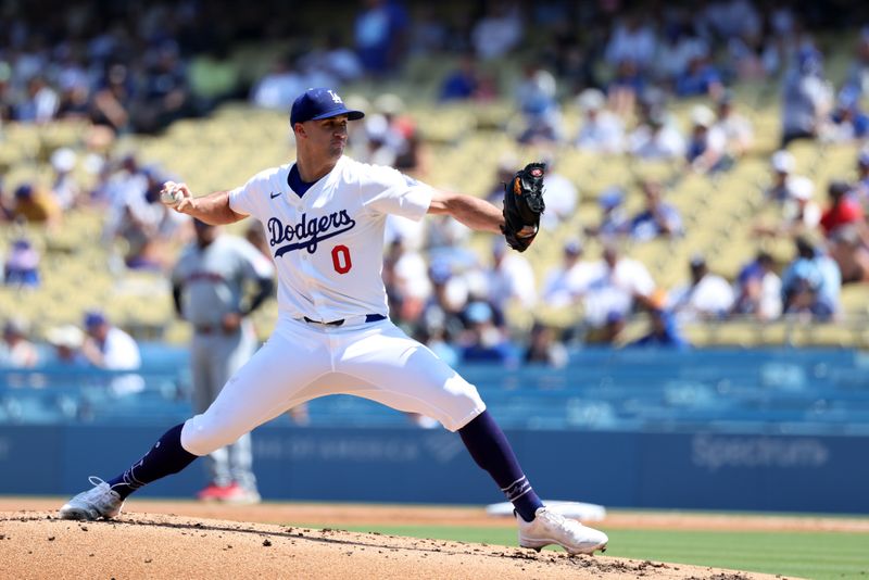 Sep 8, 2024; Los Angeles, California, USA;  Los Angeles Dodgers starting pitcher Jack Flaherty (0) pitches during the second inning against the Cleveland Guardians at Dodger Stadium. Mandatory Credit: Kiyoshi Mio-Imagn Images