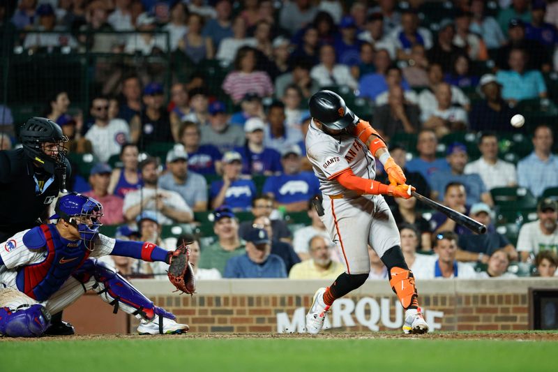 Jun 17, 2024; Chicago, Illinois, USA; San Francisco Giants second baseman Thairo Estrada (39) hits a three-run home run against the Chicago Cubs during the ninth inning at Wrigley Field. Mandatory Credit: Kamil Krzaczynski-USA TODAY Sports