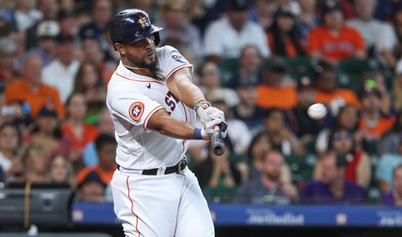 Jul 4, 2023; Houston, Texas, USA; Houston Astros first baseman Jose Abreu (79) hits a single during the second inning against the Colorado Rockies at Minute Maid Park. Mandatory Credit: Troy Taormina-USA TODAY Sports