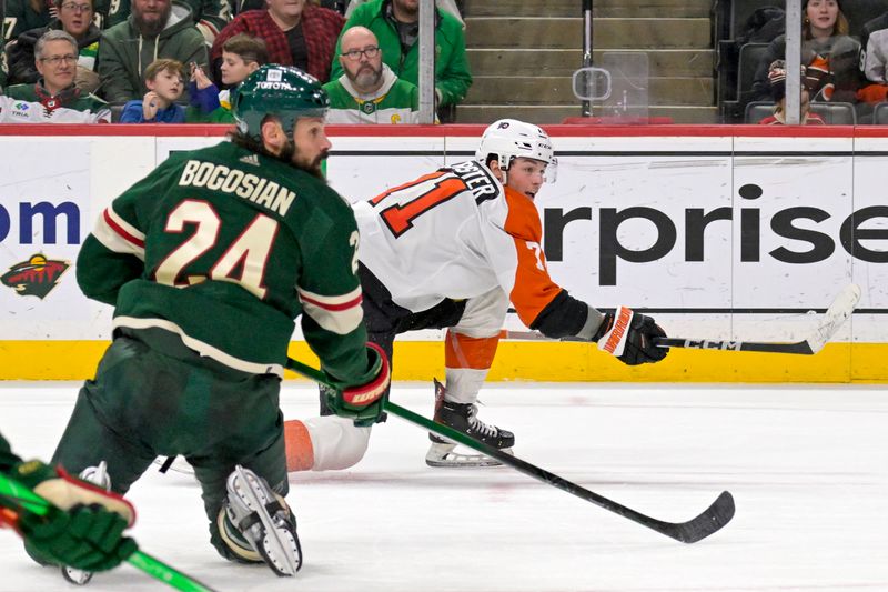 Jan 12, 2024; Saint Paul, Minnesota, USA; Philadelphia Flyers forward Tyson Foerster (71) scores a goal as Minnesota Wild defenseman Zach Bogosian (24) defends during the third period at Xcel Energy Center. Mandatory Credit: Nick Wosika-USA TODAY Sports