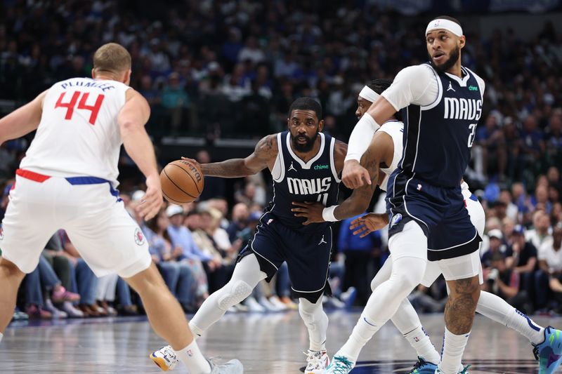 DALLAS, TX - APRIL 28: Kyrie Irving #11 of the Dallas Mavericks dribbles the ball during the game against the LA Clippers during Round 1 Game 4 of the 2024 NBA Playoffs on April 28, 2024 at the American Airlines Center in Dallas, Texas. NOTE TO USER: User expressly acknowledges and agrees that, by downloading and or using this photograph, User is consenting to the terms and conditions of the Getty Images License Agreement. Mandatory Copyright Notice: Copyright 2024 NBAE (Photo by Tim Heitman/NBAE via Getty Images)