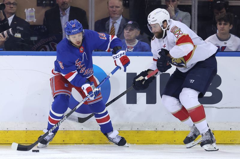 May 22, 2024; New York, New York, USA; New York Rangers left wing Artemi Panarin (10) controls the puck against Florida Panthers defenseman Aaron Ekblad (5) during the third period of game one of the Eastern Conference Final of the 2024 Stanley Cup Playoffs at Madison Square Garden. Mandatory Credit: Brad Penner-USA TODAY Sports