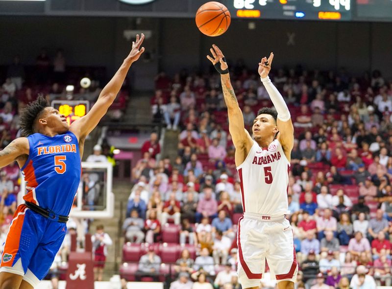 Feb 8, 2023; Tuscaloosa, Alabama, USA; Alabama Crimson Tide guard Jahvon Quinerly (5) shoots against Florida Gators guard Will Richard (5) during the second half at Coleman Coliseum. Mandatory Credit: Marvin Gentry-USA TODAY Sports