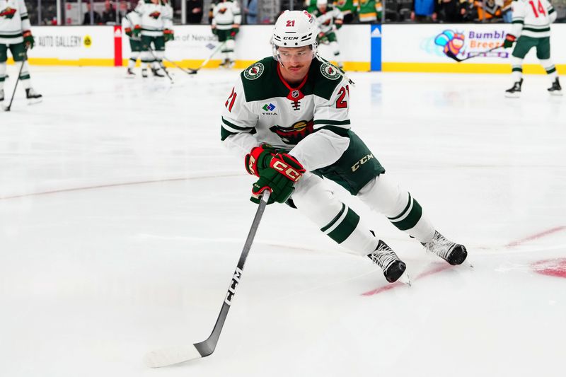 Feb 12, 2024; Las Vegas, Nevada, USA; Minnesota Wild right wing Brandon Duhaime (21) warms up before a game against the Vegas Golden Knights at T-Mobile Arena. Mandatory Credit: Stephen R. Sylvanie-USA TODAY Sports