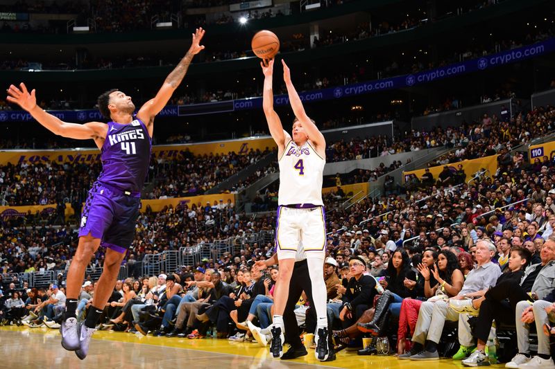 LOS ANGELES, CA - OCTOBER 26: Dalton Knecht #4 of the Los Angeles Lakers shoots a three point basket during the game  against the Sacramento Kings on October 26, 2024 at Crypto.Com Arena in Los Angeles, California. NOTE TO USER: User expressly acknowledges and agrees that, by downloading and/or using this Photograph, user is consenting to the terms and conditions of the Getty Images License Agreement. Mandatory Copyright Notice: Copyright 2024 NBAE (Photo by Adam Pantozzi/NBAE via Getty Images)