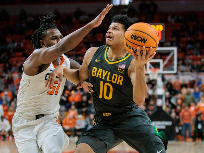 Jan 6, 2024; Stillwater, Oklahoma, USA; Baylor Bears guard RayJ Dennis (10) drives to the basket past Oklahoma State Cowboys guard John-Michael Wright (51) during the second half at Gallagher-Iba Arena. Mandatory Credit: William Purnell-USA TODAY Sports