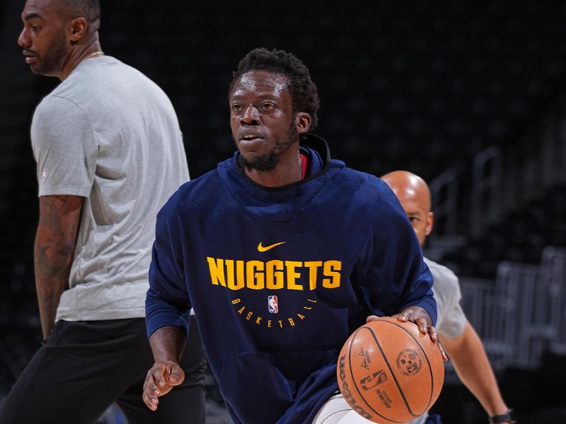 DENVER, CO - MARCH 31: Reggie Jackson #7 of the Denver Nuggets warms up before the game against the Cleveland Cavaliers on March 31, 2024 at the Ball Arena in Denver, Colorado. NOTE TO USER: User expressly acknowledges and agrees that, by downloading and/or using this Photograph, user is consenting to the terms and conditions of the Getty Images License Agreement. Mandatory Copyright Notice: Copyright 2024 NBAE (Photo by Garrett Ellwood/NBAE via Getty Images)