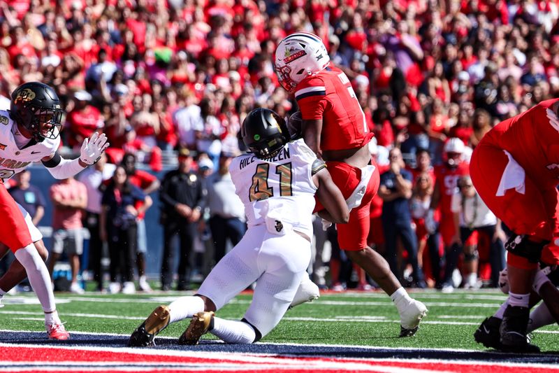 Oct 19, 2024; Tucson, Arizona, USA; Colorado Buffaloes inside linebacker Nikhai Hill-Green (41) stops Arizona Wildcats running back Quali Conley (7) from scoring during the first quarter at Arizona Stadium. Mandatory Credit: Aryanna Frank-Imagn Images