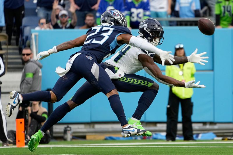 Tennessee Titans cornerback Tre Avery (23) breaks up a pass intended for Seattle Seahawks wide receiver DK Metcalf during the second half of an NFL football game on Sunday, Dec. 24, 2023, in Nashville, Tenn. (AP Photo/George Walker IV)