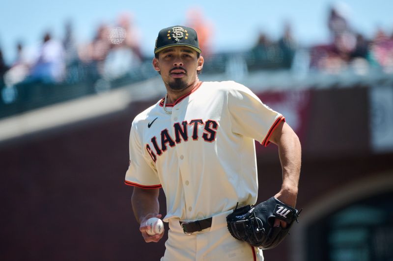 May 19, 2024; San Francisco, California, USA; San Francisco Giants starting pitcher Jordan Hicks (12) prepares to throw the first pitch of the game against the Colorado Rockies during the first inning at Oracle Park. Mandatory Credit: Robert Edwards-USA TODAY Sports