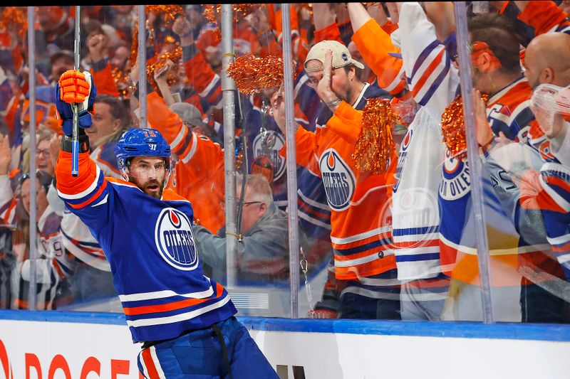 Apr 22, 2024; Edmonton, Alberta, CAN; Edmonton Oilers forward Adam Henrique (19) celebrates after scoring a goal during the first period against the Los Angeles Kings in game one of the first round of the 2024 Stanley Cup Playoffs at Rogers Place. Mandatory Credit: Perry Nelson-USA TODAY Sports