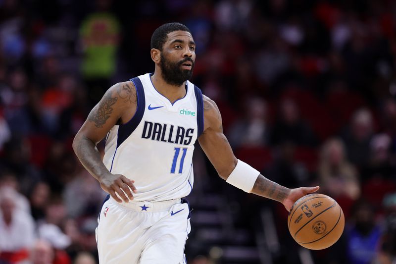 HOUSTON, TEXAS - JANUARY 01: Kyrie Irving #11 of the Dallas Mavericks moves the ball down court against the Houston Rockets during the first half at Toyota Center on January 01, 2025 in Houston, Texas. NOTE TO USER: User expressly acknowledges and agrees that, by downloading and or using this photograph, User is consenting to the terms and conditions of the Getty Images License Agreement. (Photo by Alex Slitz/Getty Images)