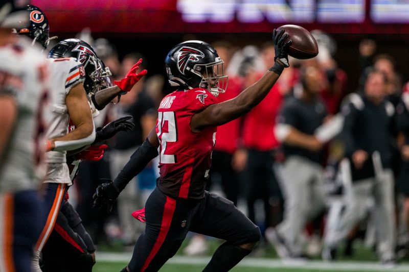 Atlanta Falcons safety Jaylinn Hawkins (32) celebrates an interception during the second half of an NFL football game against the Chicago Bears, Sunday, Nov. 20, 2022, in Atlanta. The Atlanta Falcons won 27-24. (AP Photo/Danny Karnik)