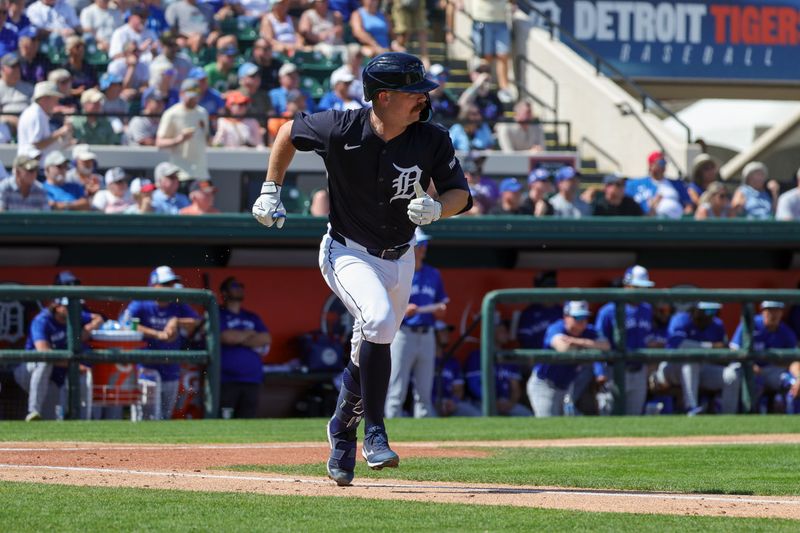 Mar 3, 2025; Lakeland, Florida, USA; Detroit Tigers catcher Jake Rogers (34) runs to first base on a single during the third inning against the Toronto Blue Jays at Publix Field at Joker Marchant Stadium. Mandatory Credit: Mike Watters-Imagn Images