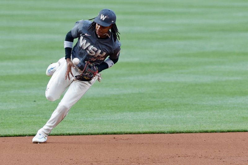 May 7, 2024; Washington, District of Columbia, USA; Washington Nationals shortstop CJ Abrams (5) commits an error while attempting to field a ground ball by Baltimore Orioles third baseman Jordan Westburg (not pictured) during the second inning at Nationals Park. Mandatory Credit: Geoff Burke-USA TODAY Sports