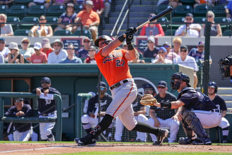 Feb 26, 2023; Lakeland, Florida, USA; Baltimore Orioles catcher James McCann (27) bats against the Detroit Tigers at Publix Field at Joker Marchant Stadium. Mandatory Credit: Mike Watters-USA TODAY Sports