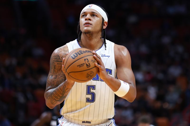 MIAMI, FLORIDA - FEBRUARY 06: Paolo Banchero #5 of the Orlando Magic shoots a free throw against the Miami Heat during the first quarter of the game at Kaseya Center on February 06, 2024 in Miami, Florida. NOTE TO USER: User expressly acknowledges and agrees that, by downloading and or using this photograph, User is consenting to the terms and conditions of the Getty Images License Agreement. (Photo by Megan Briggs/Getty Images)