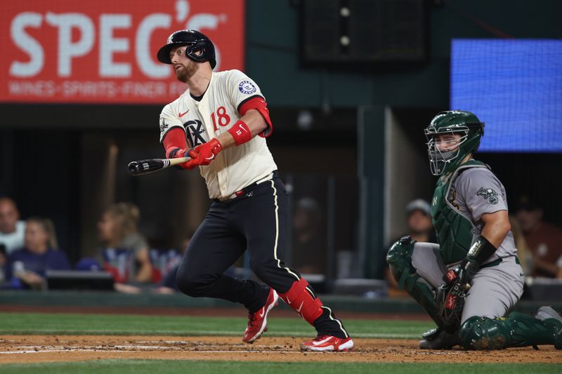 Aug 30, 2024; Arlington, Texas, USA; Texas Rangers designated hitter Robbie Grossman (4) hits a double in the second inning against the Oakland Athletics at Globe Life Field. Mandatory Credit: Tim Heitman-USA TODAY Sports