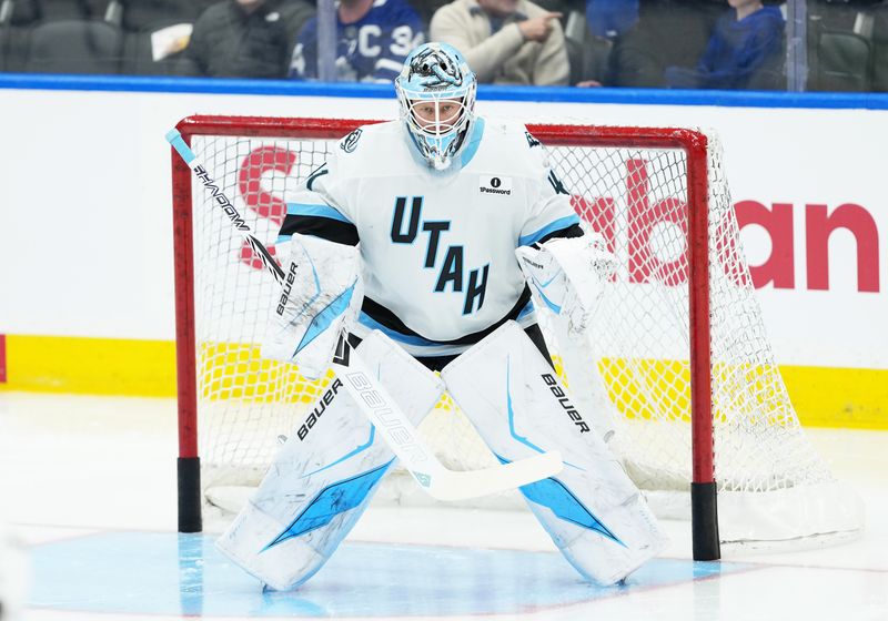 Nov 5, 2025; Toronto, Ontario, CAN; Utah Mammoth goaltender Vitek Vanecek (41) takes pucks during the warmup before a game against the Toronto Maple Leafs at Scotiabank Arena. Mandatory Credit: Nick Turchiaro-Imagn Images