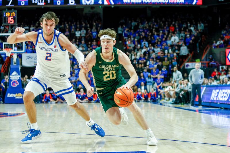 Jan 9, 2024; Boise, Idaho, USA; Colorado State Rams guard Joe Palmer (20) drives past Boise State Broncos forward Tyson Degenhart (2) during the first half at ExtraMile Arena. Mandatory Credit: Brian Losness-USA TODAY Sports