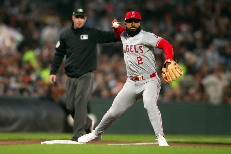 Jun 14, 2024; San Francisco, California, USA; Los Angeles Angels third baseman Luis Rengifo (2) steps on third base to start a double play against the San Francisco Giants during the fourth inning at Oracle Park. Mandatory Credit: D. Ross Cameron-USA TODAY Sports