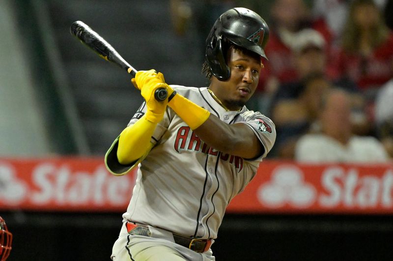 Jul 12, 2025; Anaheim, California, USA;  Arizona Diamondbacks shortstop Geraldo Perdomo (2) grounds out to first base in the eighth inning at Angel Stadium. Mandatory Credit: Jayne Kamin-Oncea-Imagn Images