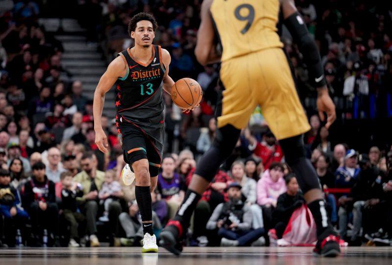 TORONTO, ON - APRIL 7: Jordan Poole #13 of the Washington Wizards dribbles against the Toronto Raptors during the first half of their basketball game at the Scotiabank Arena on April 7, 2024 in Toronto, Ontario, Canada. NOTE TO USER: User expressly acknowledges and agrees that, by downloading and/or using this Photograph, user is consenting to the terms and conditions of the Getty Images License Agreement. (Photo by Mark Blinch/Getty Images)