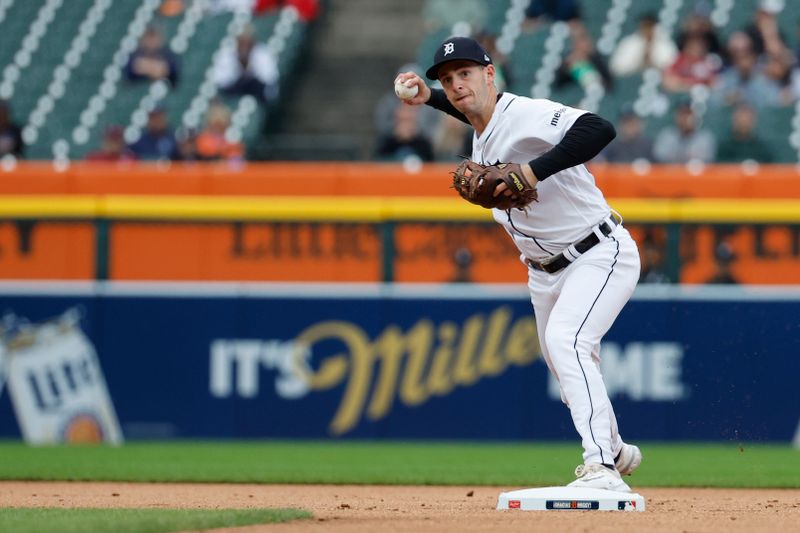 Sep 28, 2023; Detroit, Michigan, USA; Detroit Tigers second baseman Zack Short (59) makes a throw to first in the first inning against the Kansas City Royals at Comerica Park. Mandatory Credit: Rick Osentoski-USA TODAY Sports