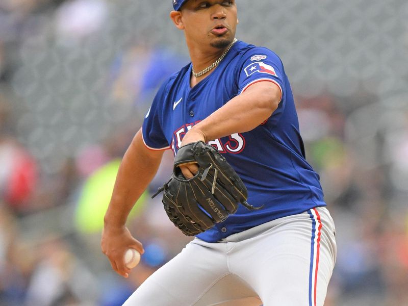 May 26, 2024; Minneapolis, Minnesota, USA;  Texas Rangers pitcher Gerson Garabito (58) delivers a pitch against the Minnesota Twins during the first inning at Target Field. Mandatory Credit: Nick Wosika-USA TODAY Sports