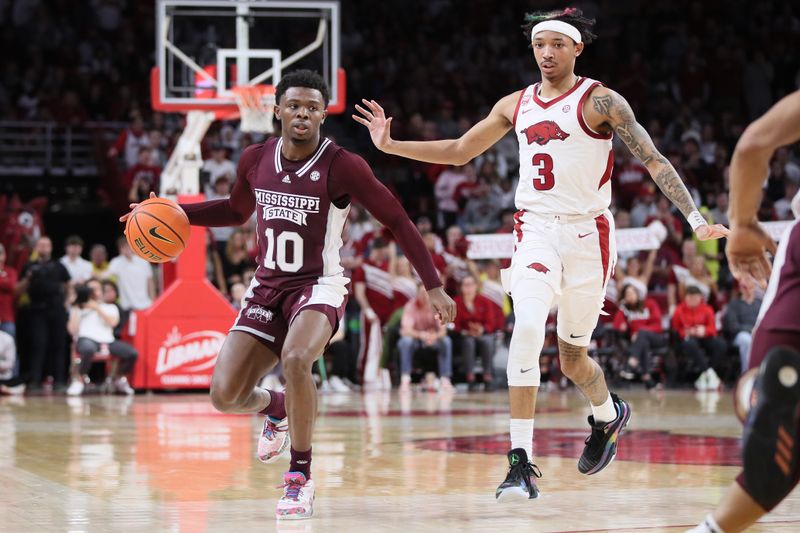 Feb 11, 2023; Fayetteville, Arkansas, USA; Mississippi State Bulldogs guard Dashawn Davis (10) dribbles by Arkansas Razorbacks guard Nick Smith Jr (3) during the second half at Bud Walton Arena. Bulldogs won 70-64. Mandatory Credit: Nelson Chenault-USA TODAY Sports