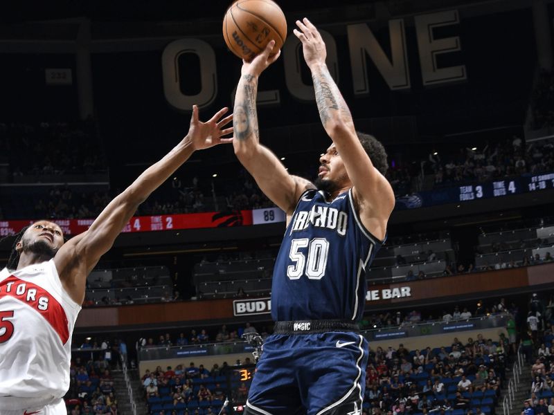 ORLANDO, FL - MARCH 17: Cole Anthony #50 of the Orlando Magic shoots the ball during the game against the Toronto Raptors on March 17, 2024 at the Kia Center in Orlando, Florida. NOTE TO USER: User expressly acknowledges and agrees that, by downloading and or using this photograph, User is consenting to the terms and conditions of the Getty Images License Agreement. Mandatory Copyright Notice: Copyright 2024 NBAE (Photo by Fernando Medina/NBAE via Getty Images)